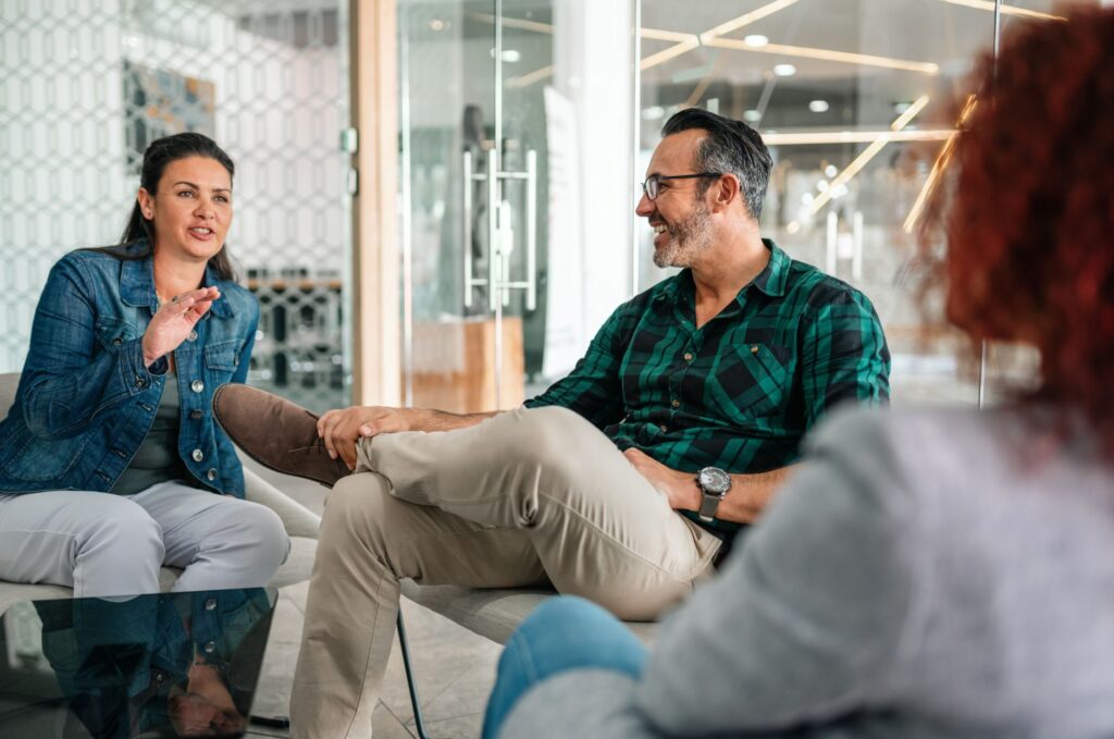 Three people discussing at the office