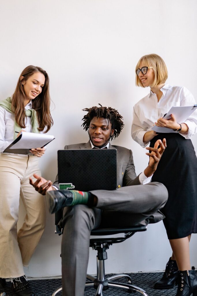 Three young colleagues talking together